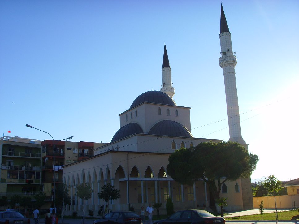 The Parruca Mosque in Shkodra with its minarets and domes against a clear sky