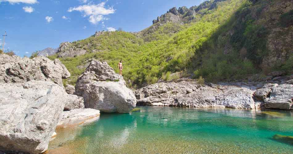 Clear river pool among white rocks near Prekal on the road into the northern mountains