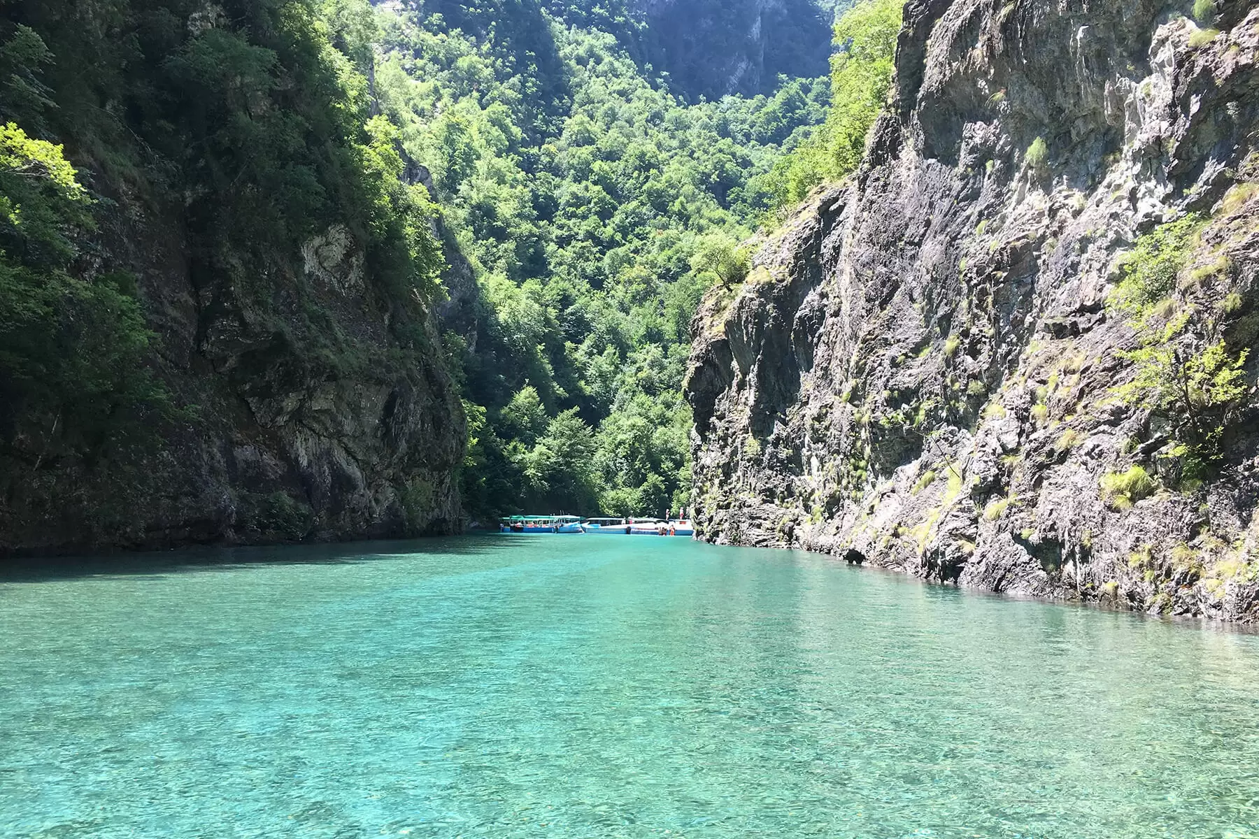 Turquoise water of the Shala River between steep canyon cliffs in northern Albania