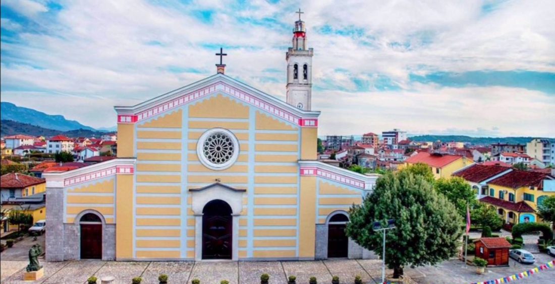 The yellow facade and bell tower of the Catholic cathedral in Shkodra