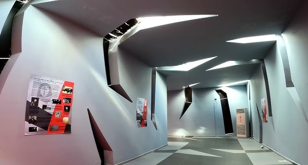 Angular grey concrete interior of the Site of Witness and Memory museum in Shkodra