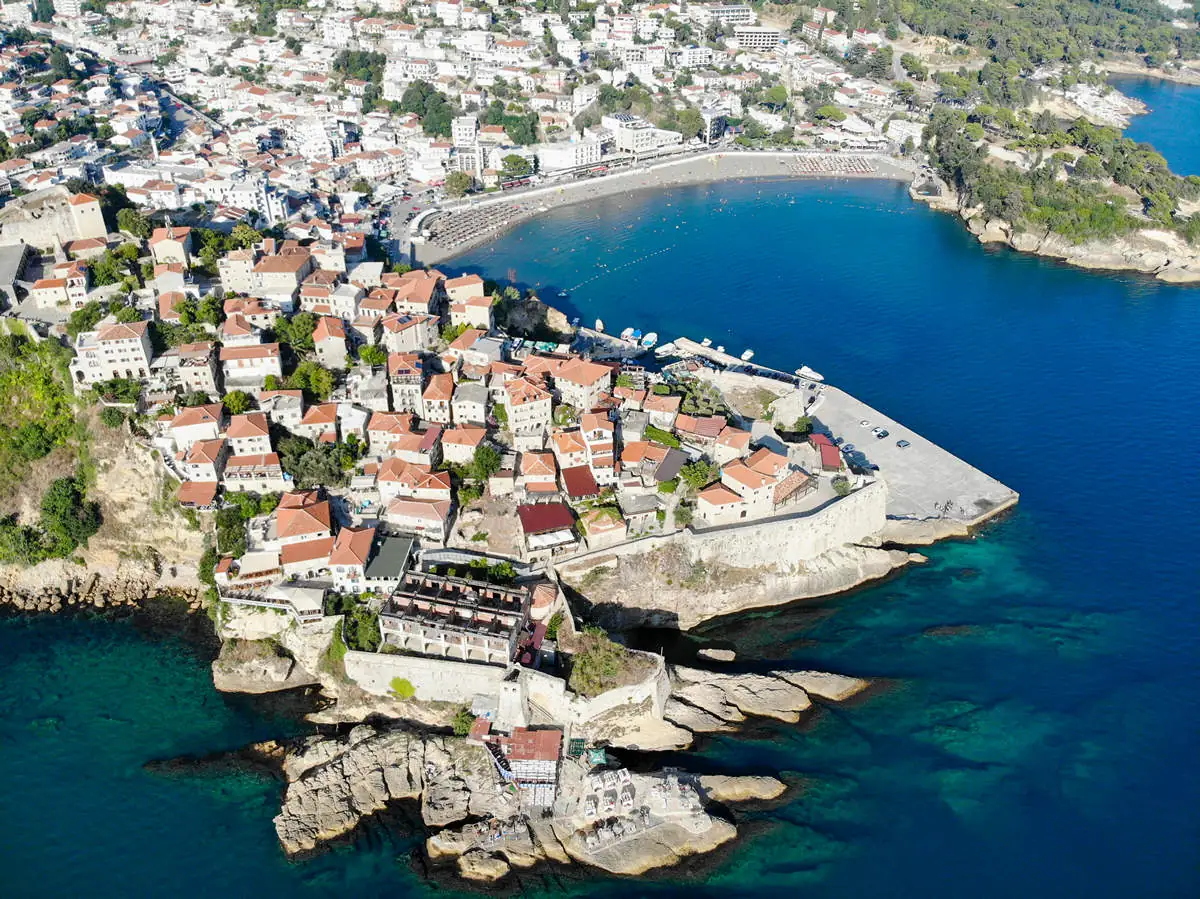 Aerial view of the walled old town of Ulcinj on its rocky peninsula above the sea, Montenegro